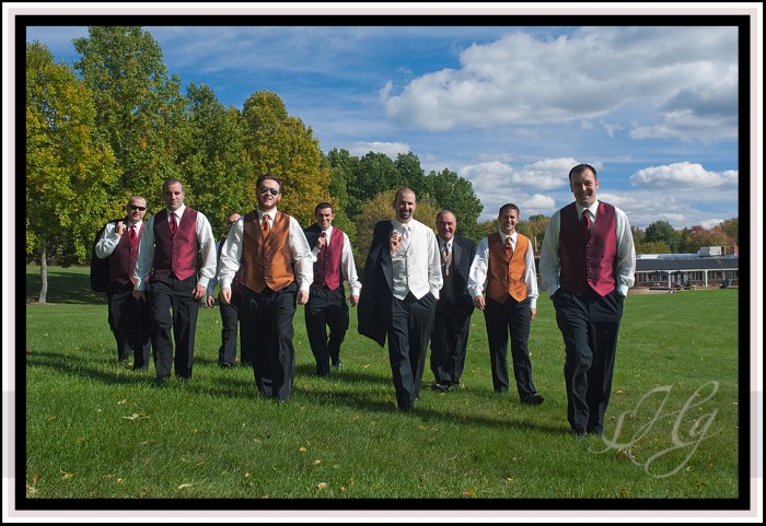  the guys in the wedding party different colors for the vests and ties